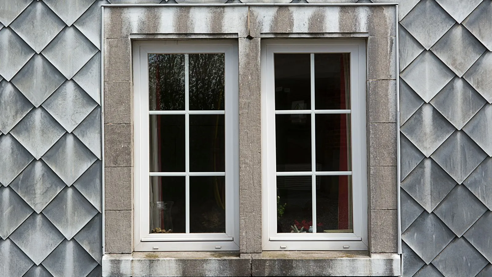 Pair of white-framed casement windows, a common choice when pricing double glazing cost